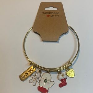 Handmade gold tone stainless steel bracelet with 5 charms.